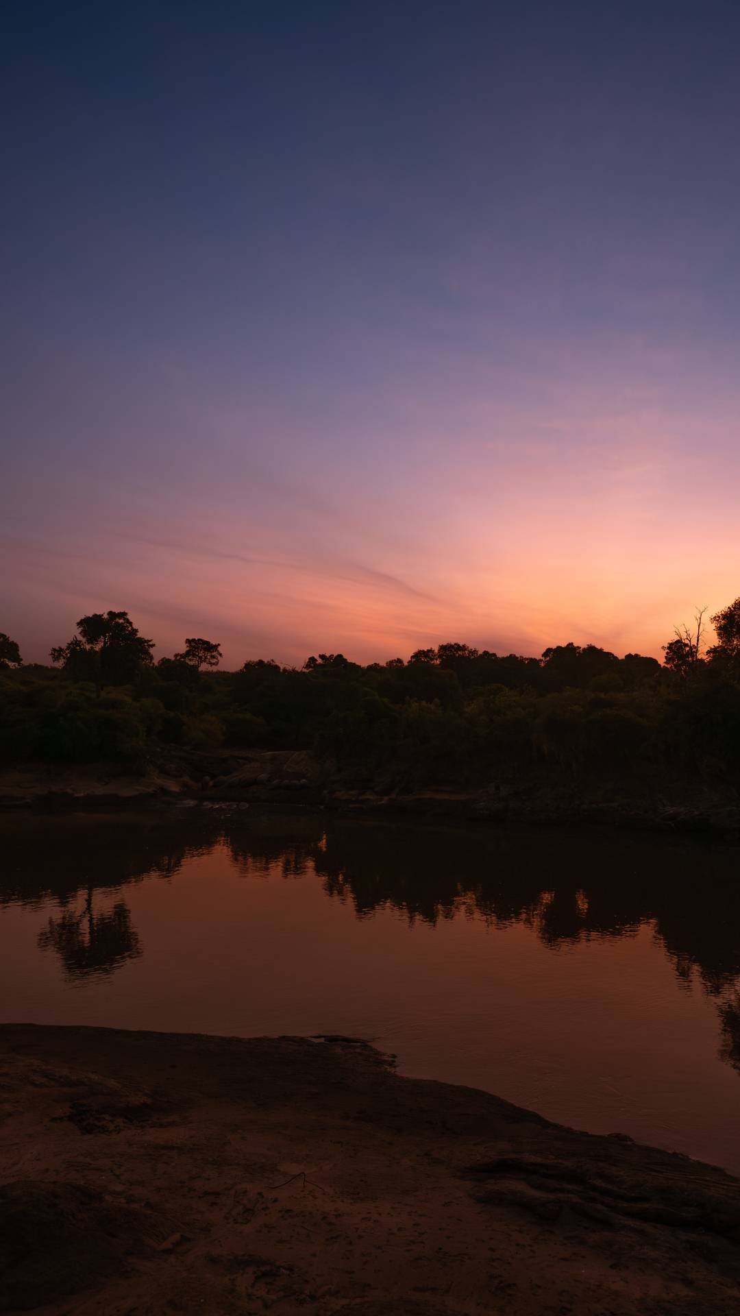 A image of the sunset over the mara river in the masai mara taken by a private guide