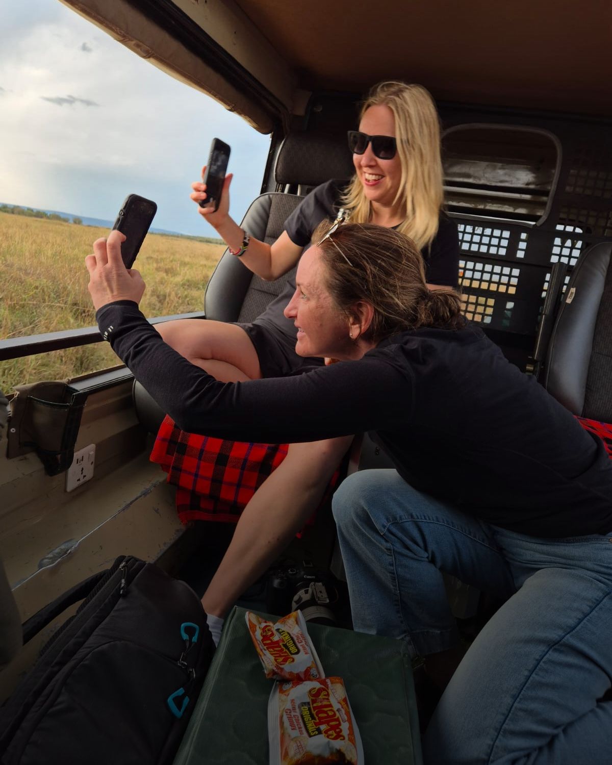 an image of guests on a photo tour in the masai mara