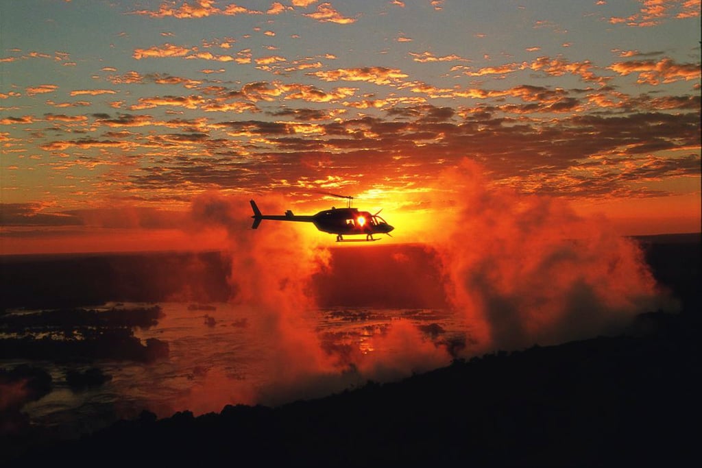 Helicopter over vic falls - discover zimbabwe adventure and action