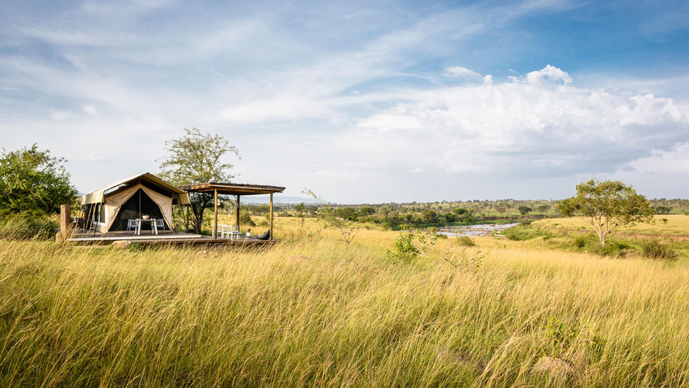 an image of the guest room at the mara river tented camo in tanzania