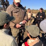 Vet explaining the procedure of black rhino darting to kids